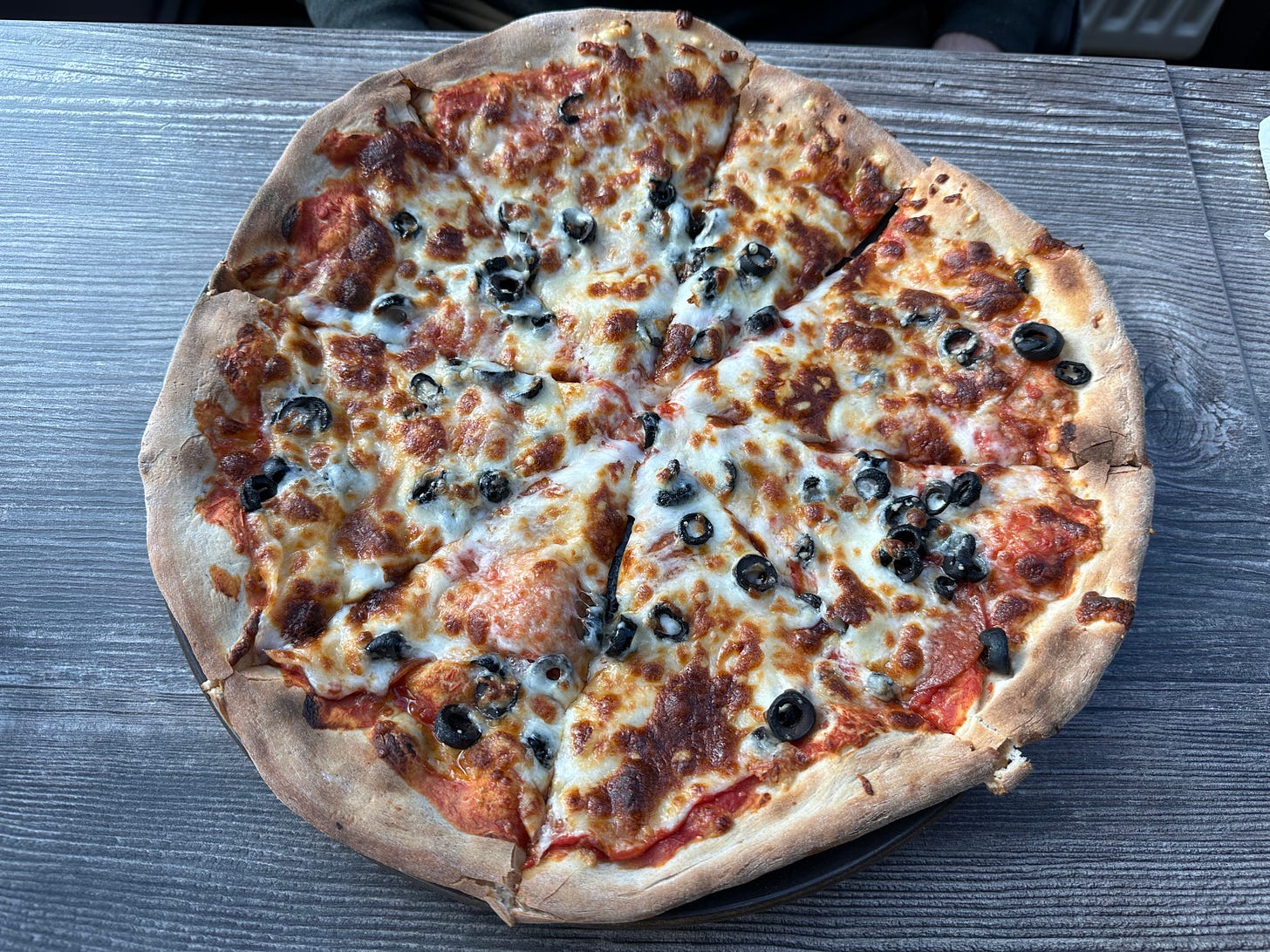 Crispy, hand tossed pepperoni and black olive pizza.