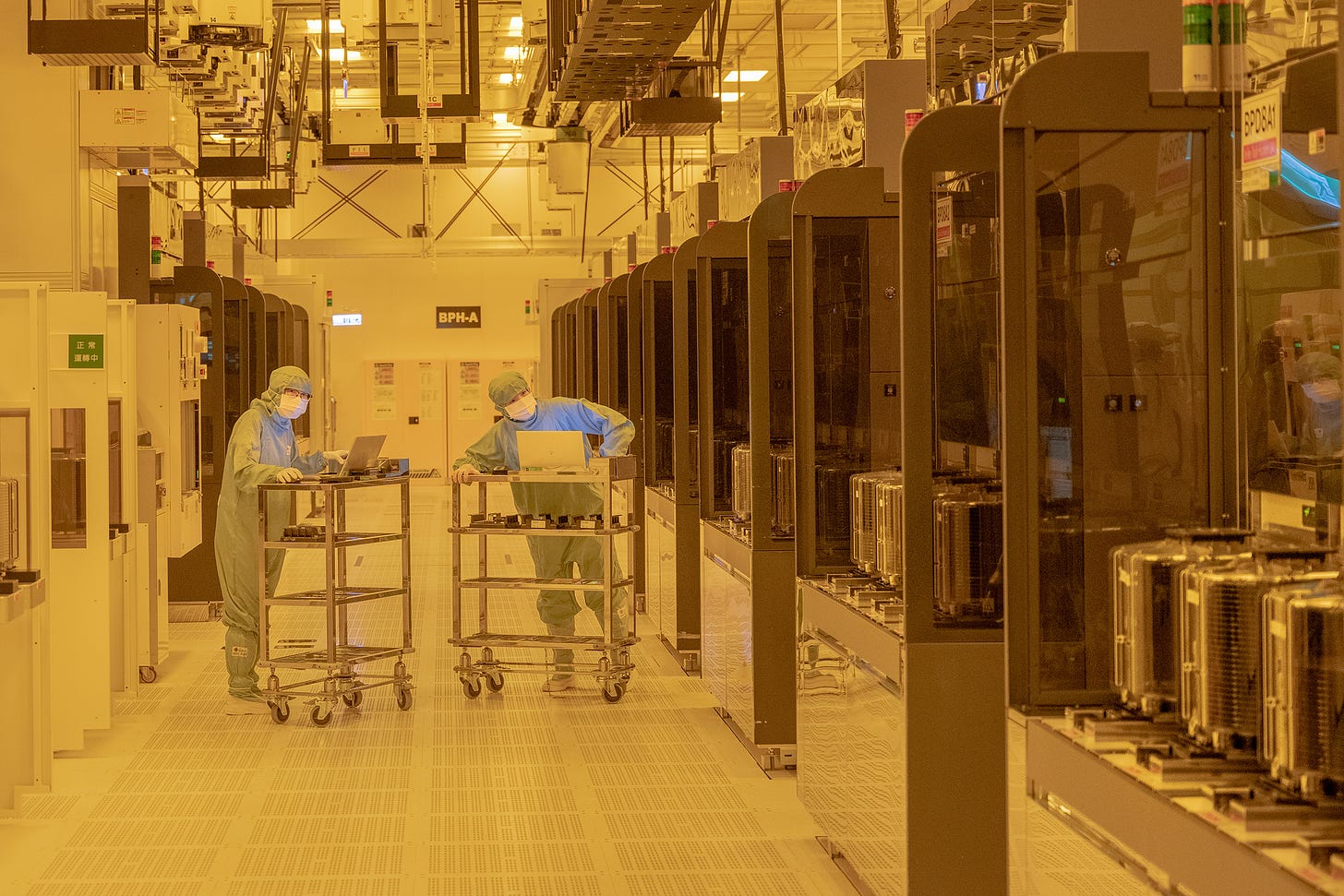 TSMC workers in the “clean room” where fabrication of chips takes place in the company’s Hsinchu headquarters