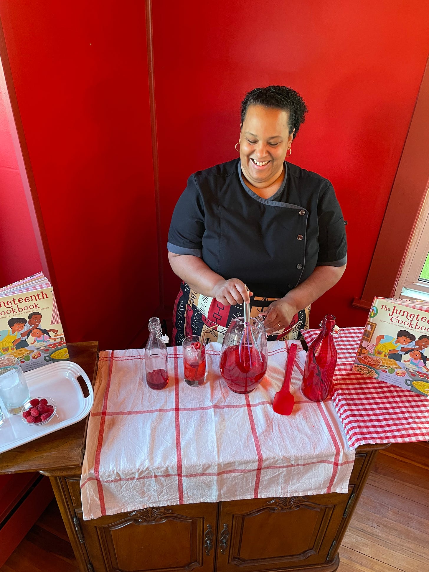 Taffy mixing up a beverage from the Juneteenth Cookbook