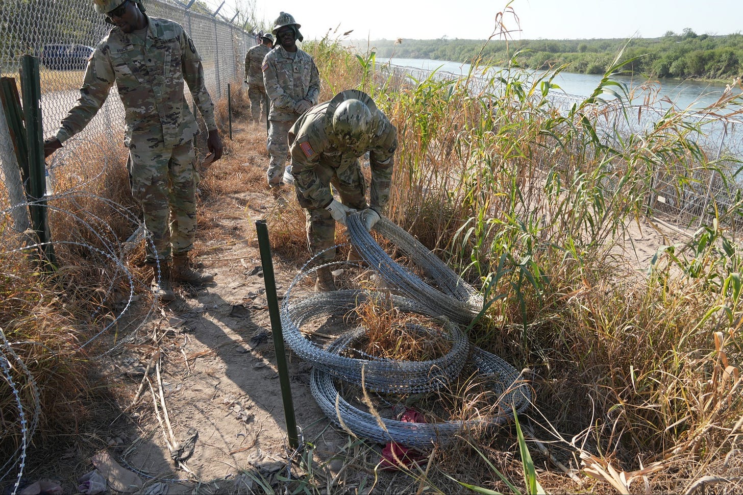 Texas National Guard troops install concertina along the Rio Grande wire to deter migrants from illegally entering the state (Nov. 18, 2024)