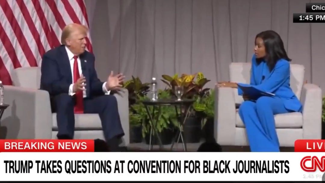 two chairs, Trump sitting left, journalist on the right