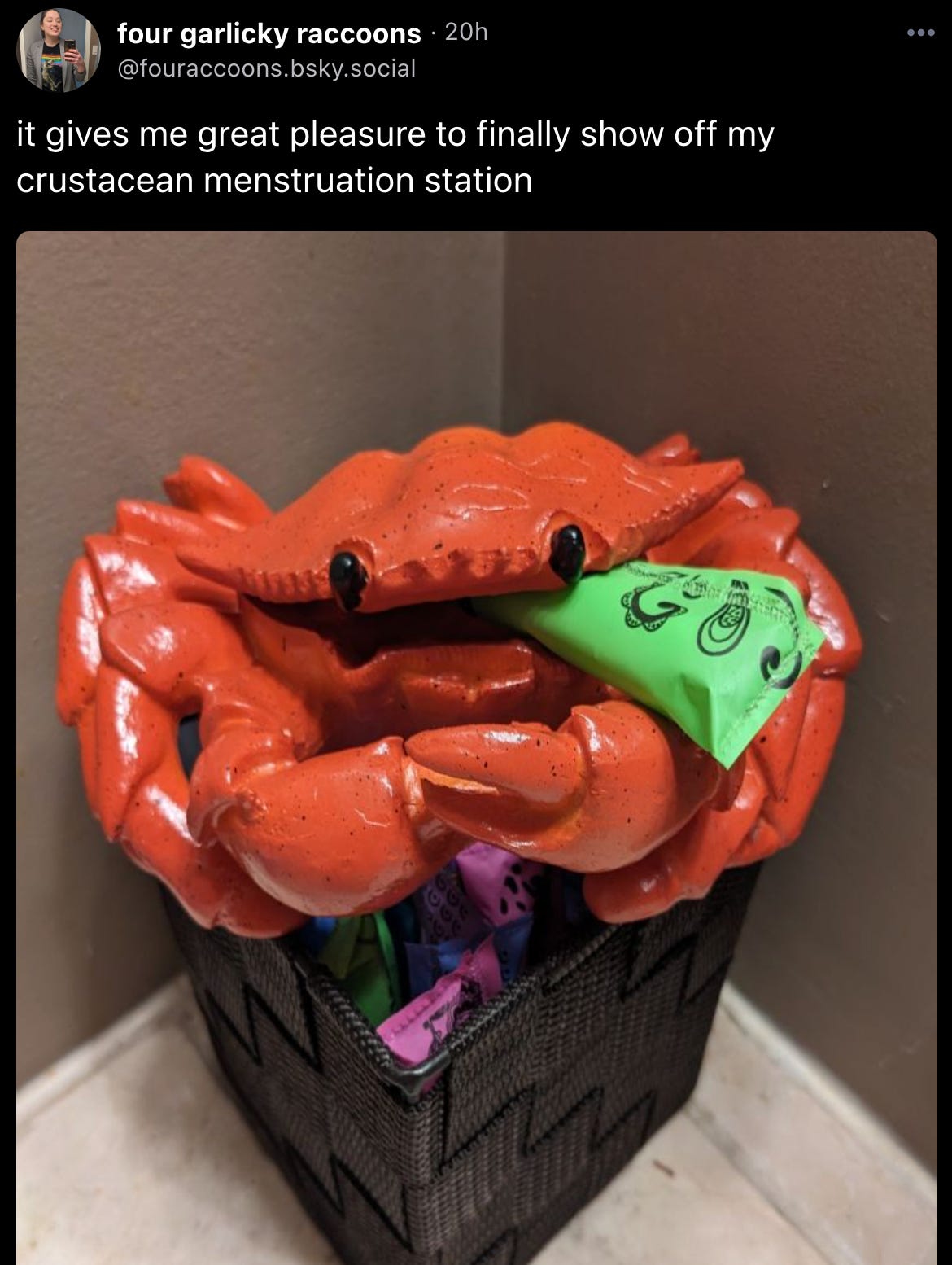Skeet by fouraccoons: “it gives me great pleasure to finally show off my crustacean menstruation station” with an image described as: “A ceramic crab ashtray sits atop a bin of menstrual products on a bathroom counter. the crab has a tampon sticking out of its mouth like a cigarette”