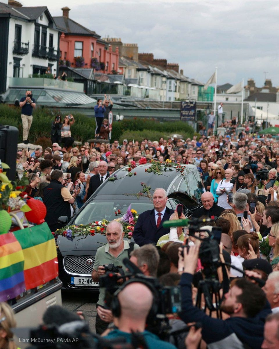 Fans of Sinead O'Connor line the street as her funeral cortege passes through her former hometown of Bray, Co Wicklow, Ireland. 