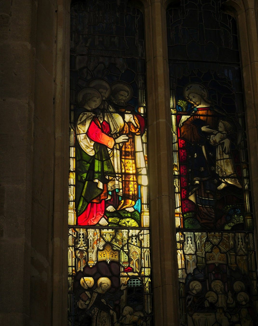 a stained glass window in a stone building