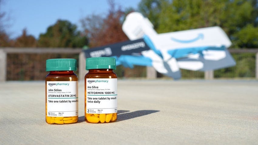Amazon Pharmacy medication bottles with drone in the background