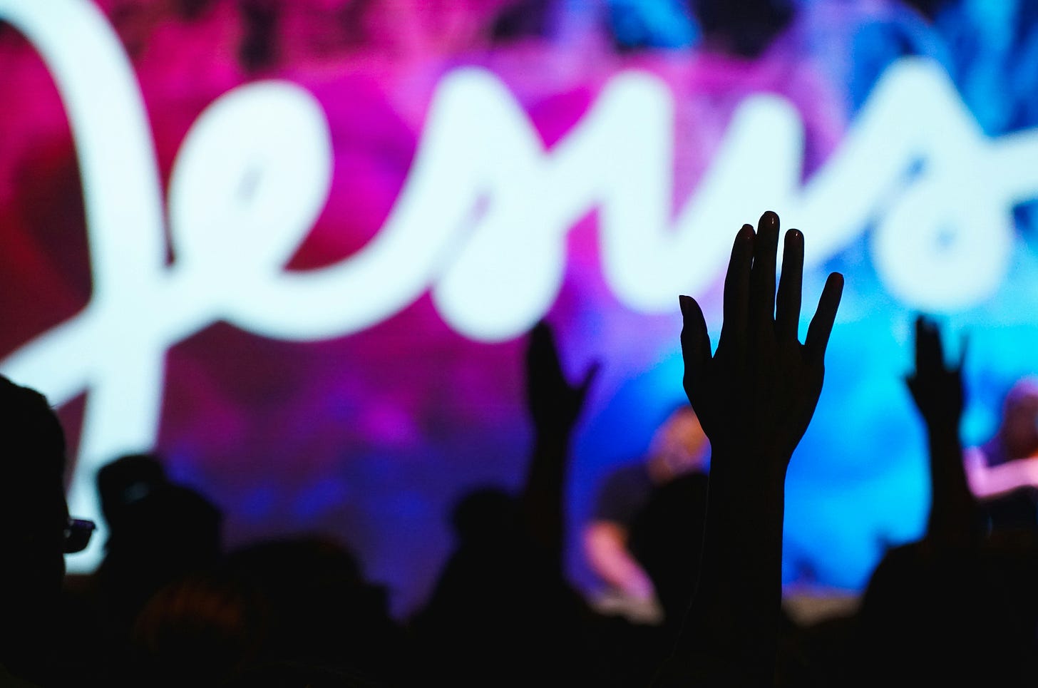 Churchgoers raising their hands in worship