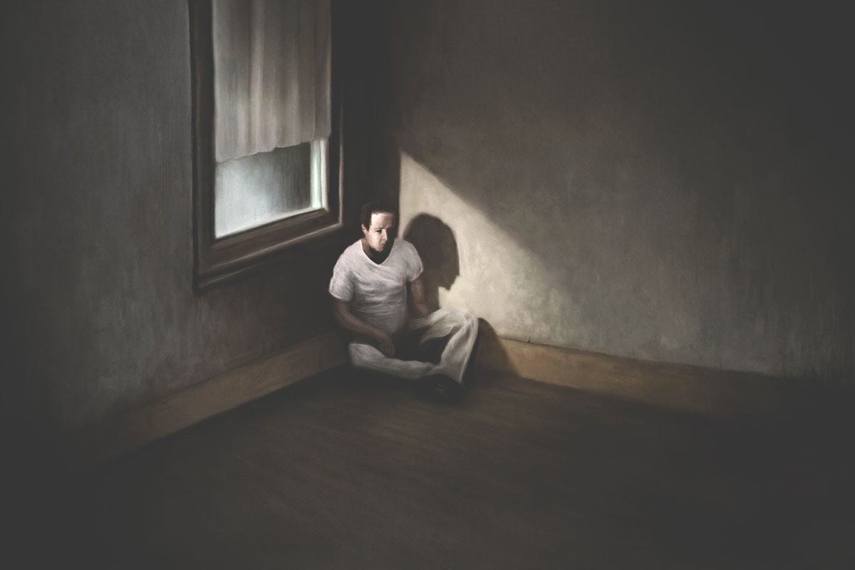 Depressed Man Isolated in Dark Room