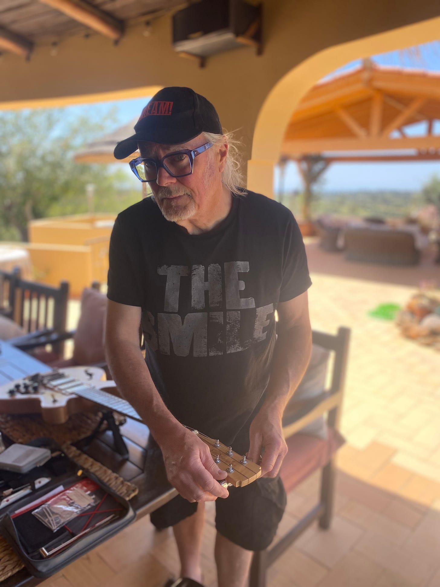 Simon Campbell changing strings on his Jim Drake guitar in the Algarve, Portugal. Strings by Curt Mangan.