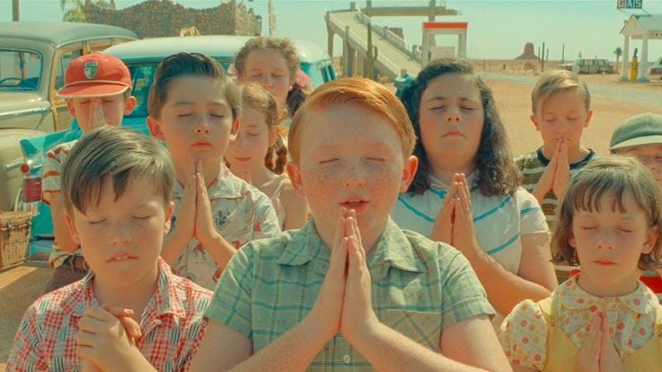 This may contain: a group of young children standing next to each other