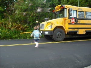 Child and schoolbus