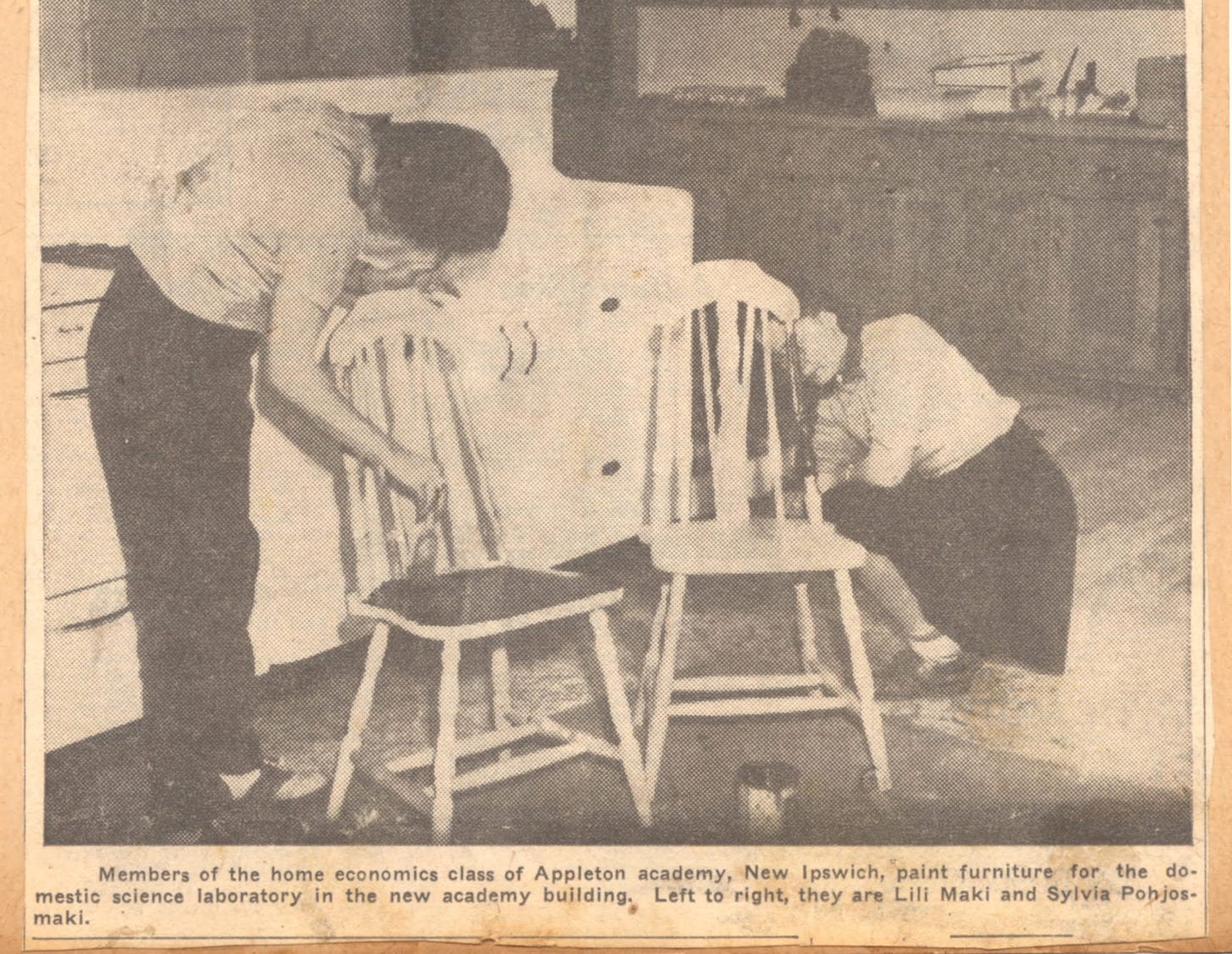 students painting chairs