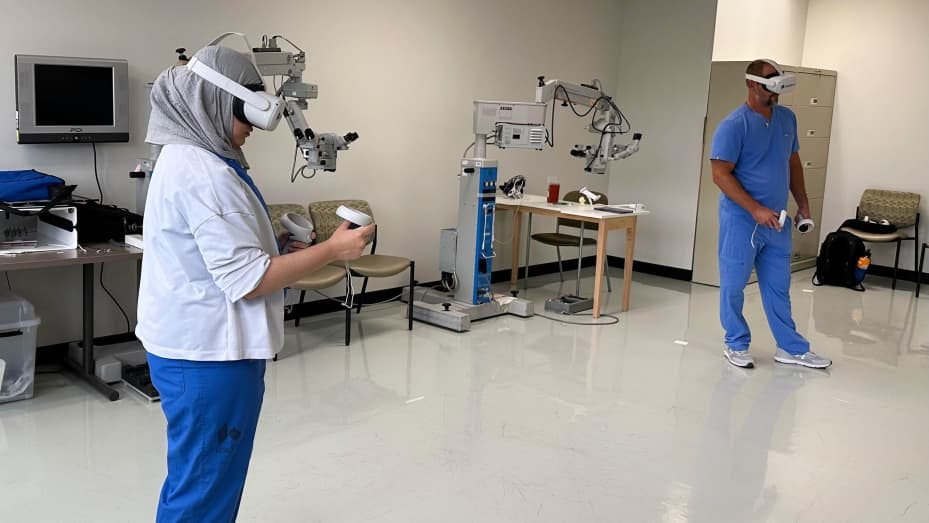 Doctors at Kettering Health Dayton practice with VR headsets.
