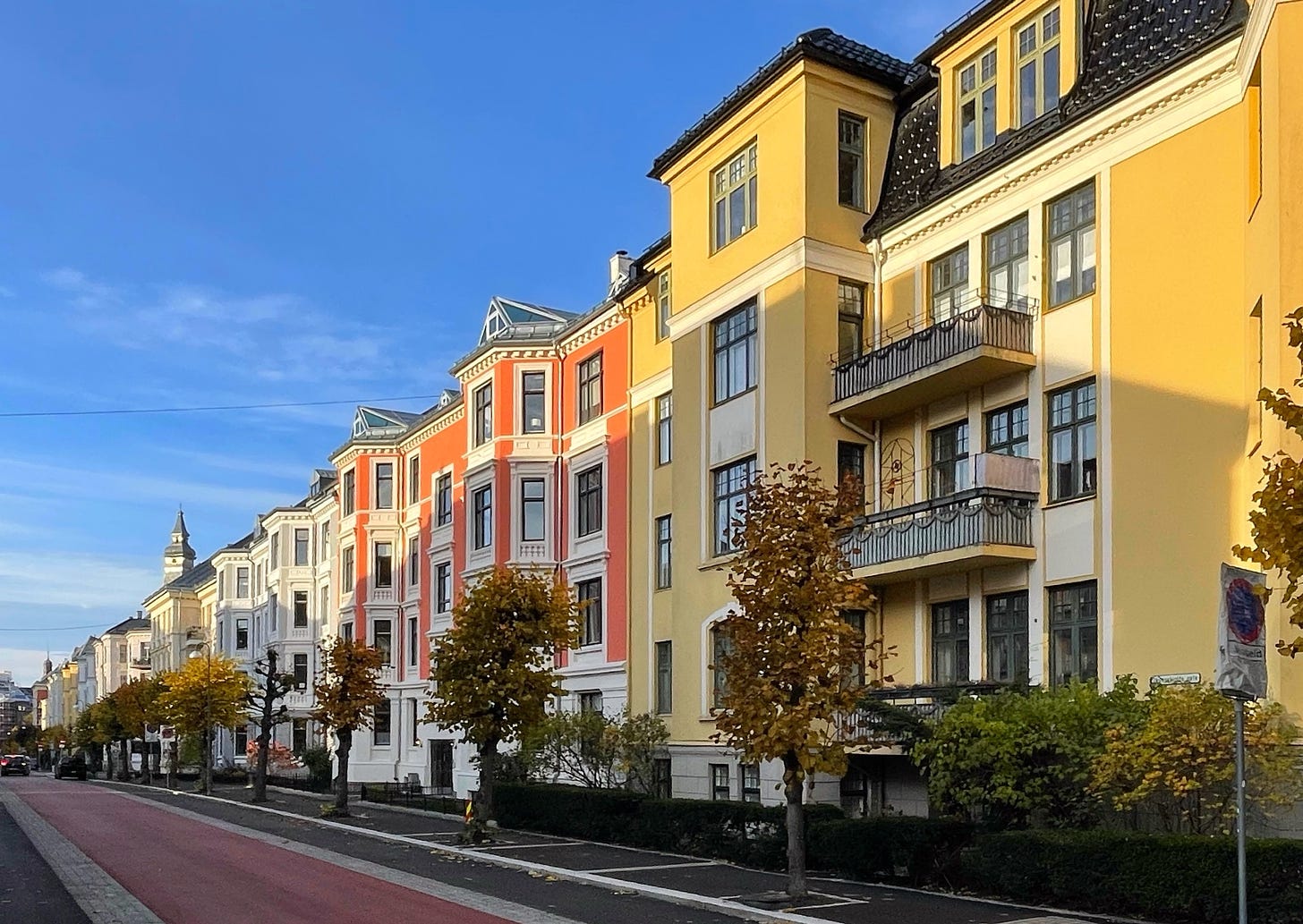 a colorful row of houses against a blue sky