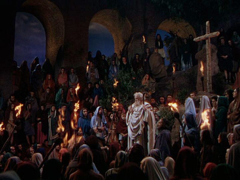 Christians gather in secret, addressed by Peter, his crook in hand, production still from 1951 epic Quo Vadis