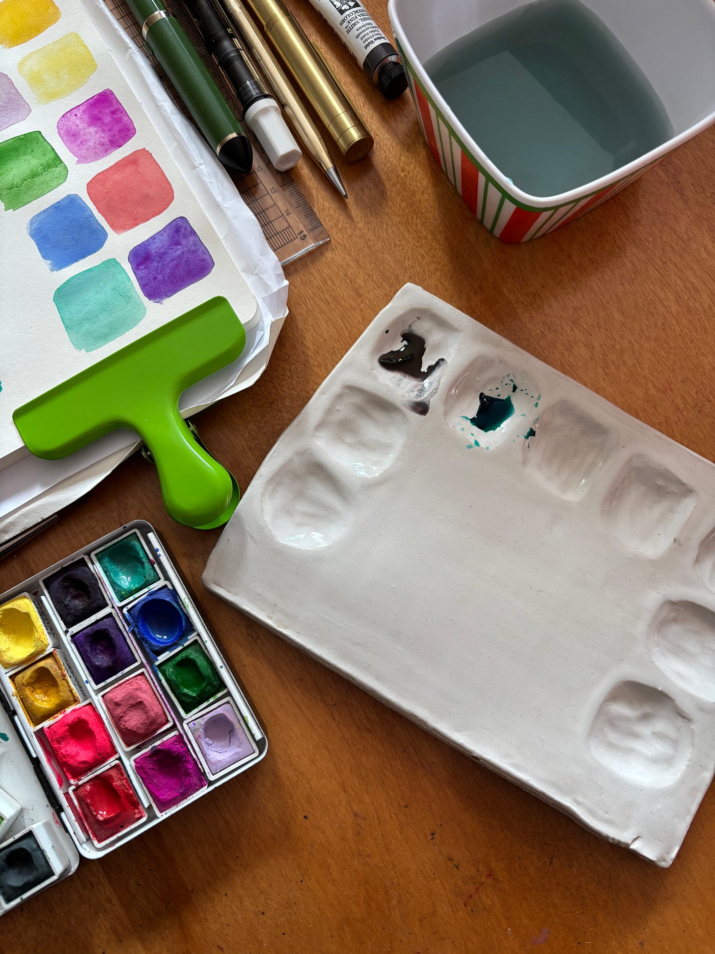 Watercolor palette and ceramic mixing palette