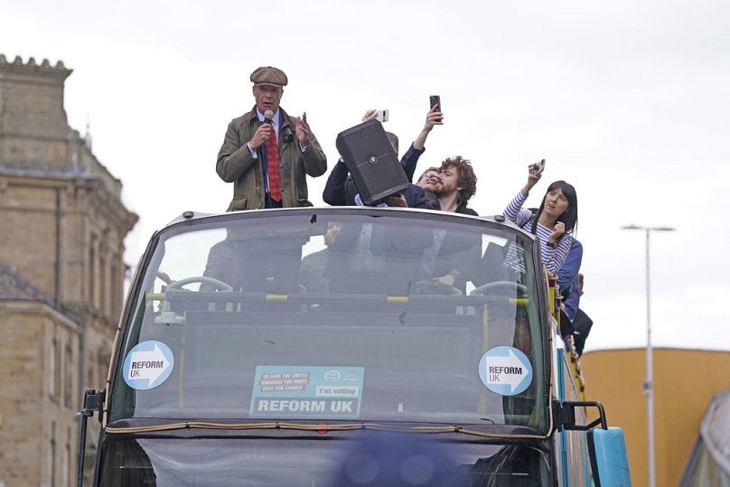 Reform UK leader Nigel Farage speaks onboard the Reform UK campaign bus in Barnsley, England.