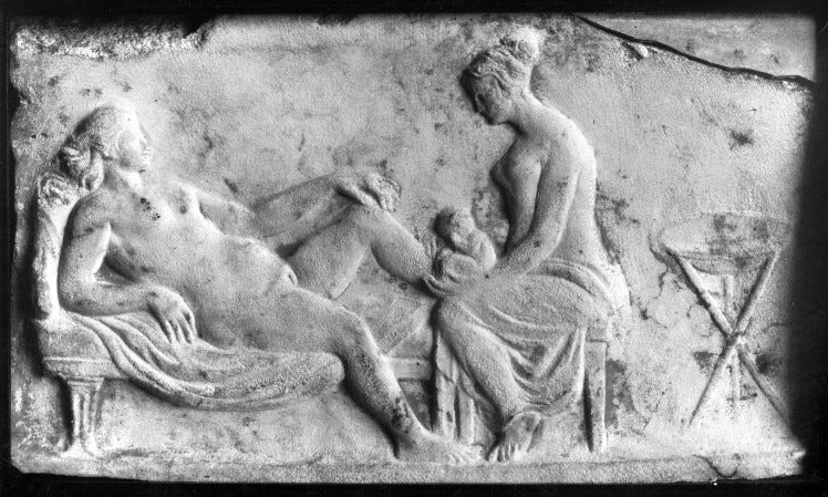 Ancient_Roman_relief_carving_of_a_midwife_Wellcome_M0003964.jpg