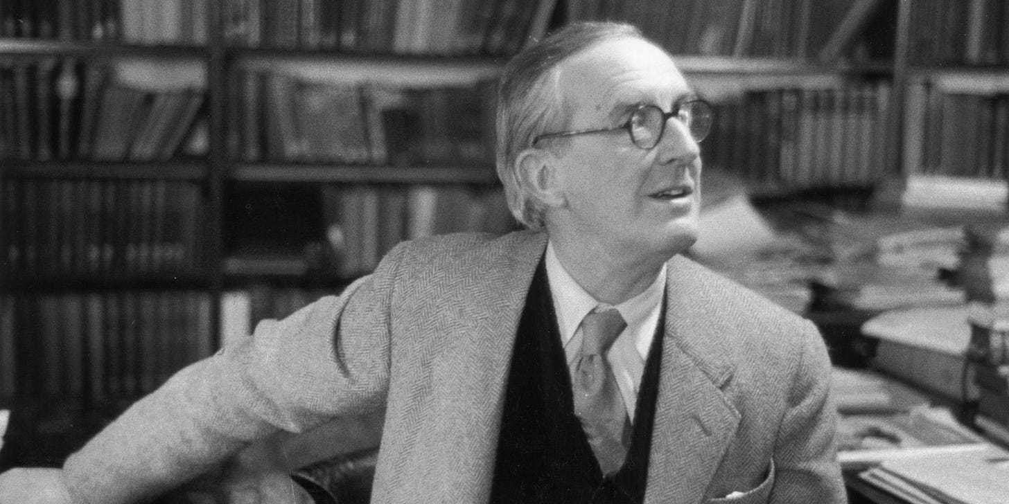 Tolkien wearing glasses looks to his left