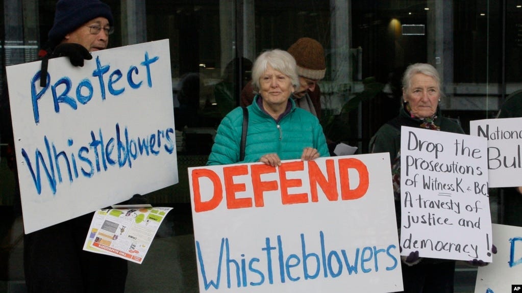 FILE - Whistleblower supporters demonstrate outside the Australian Capital Territory Supreme Court on June 27, 2019, in Canberra, Australia, where former army lawyer David McBride appeared, charged with leaking secret documents.
