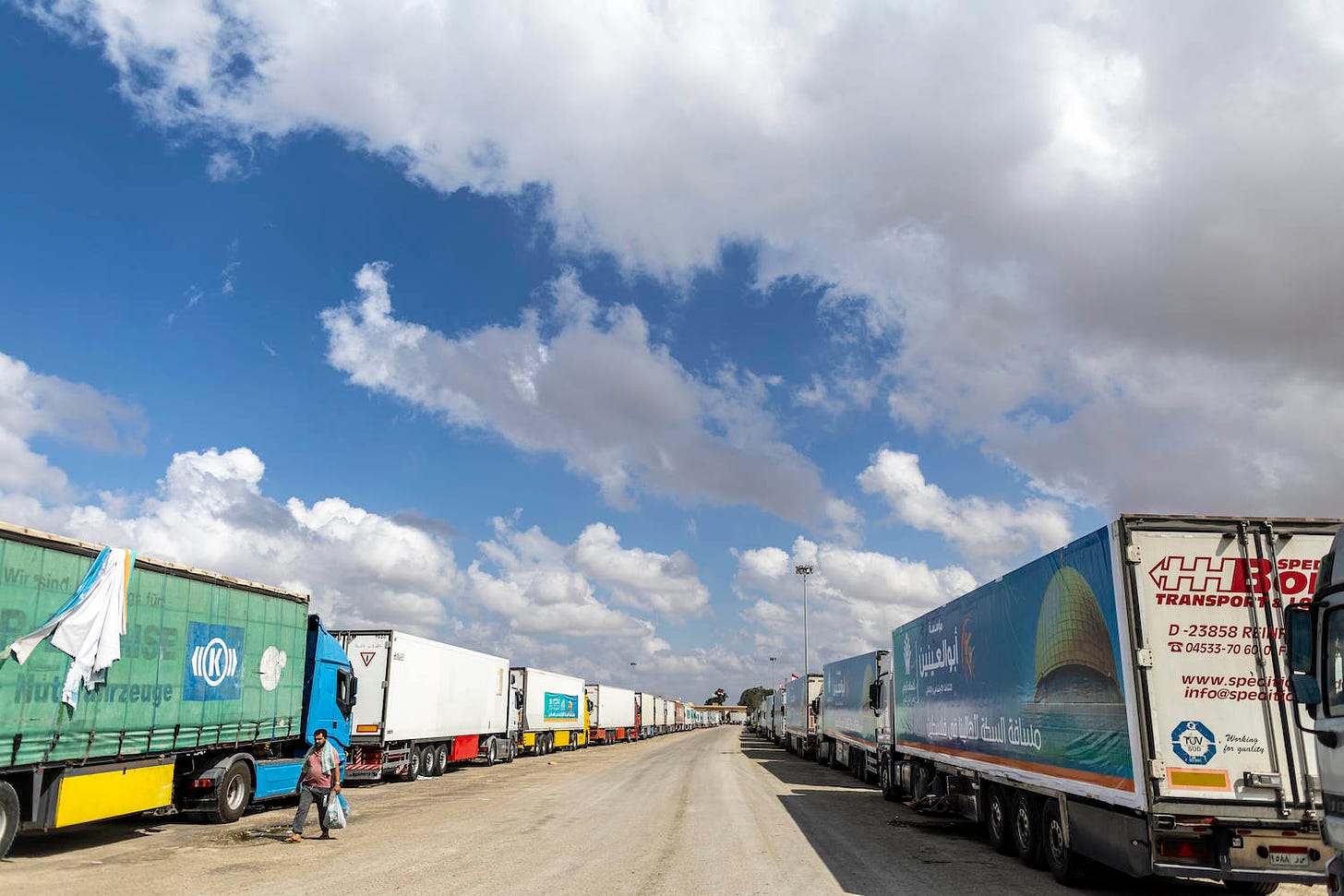 Trucks carrying aid line up near the Rafah Border Crossing in Egypt.