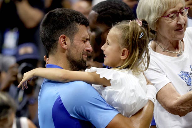 Novak Djokovic of Serbia celebrates with daughter Tara after defeating Daniil Medvedev of Russia during their Men's Singles Final match on Day...