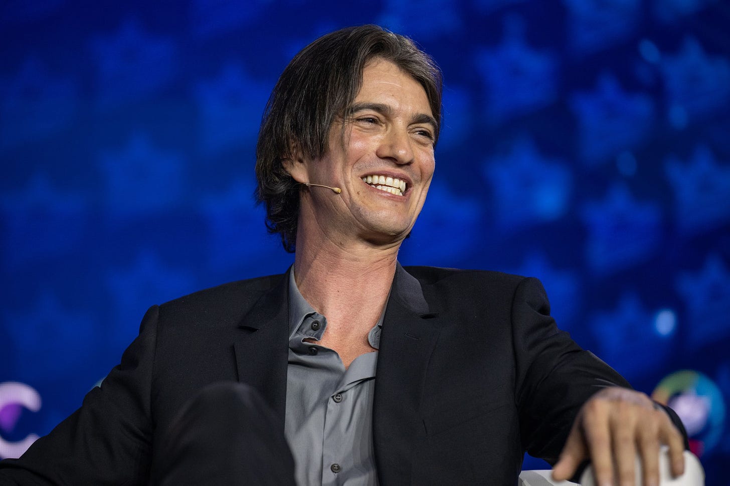 Adam Neumann sitting on-stage at the Israeli American Council 8th Annual National Summit