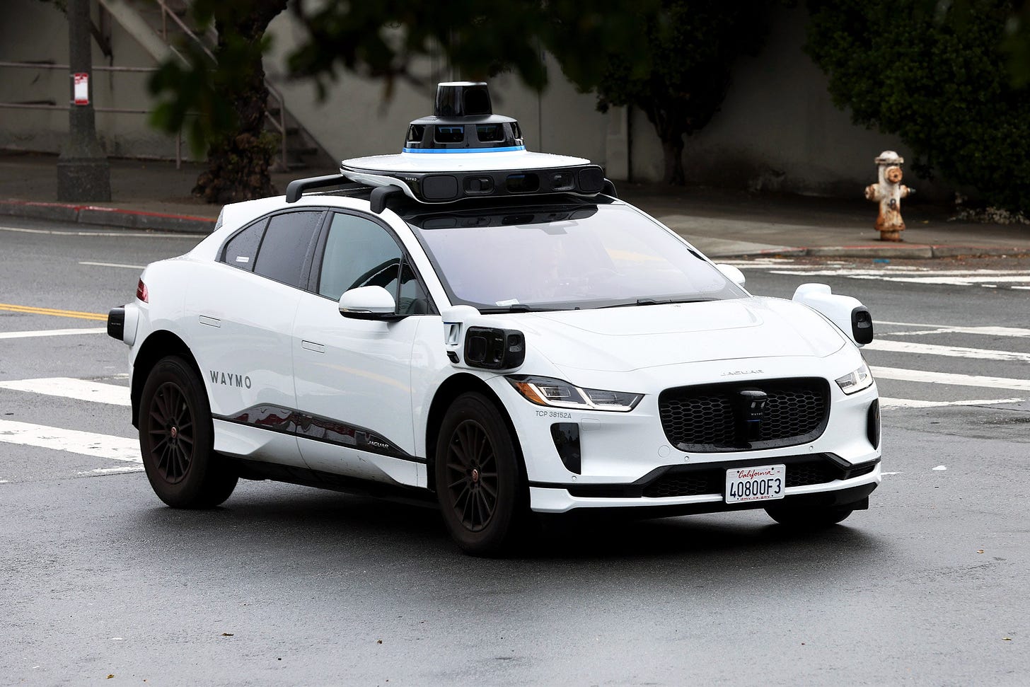 A white Waymo vehicle on a San Francisco street