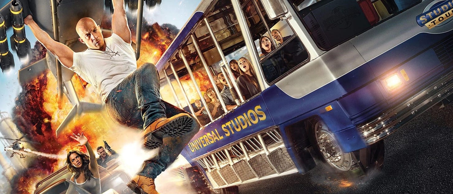 A rendering of cast members from the Fast and the Furious cast involved in some action in front of the famous studio tour bus.