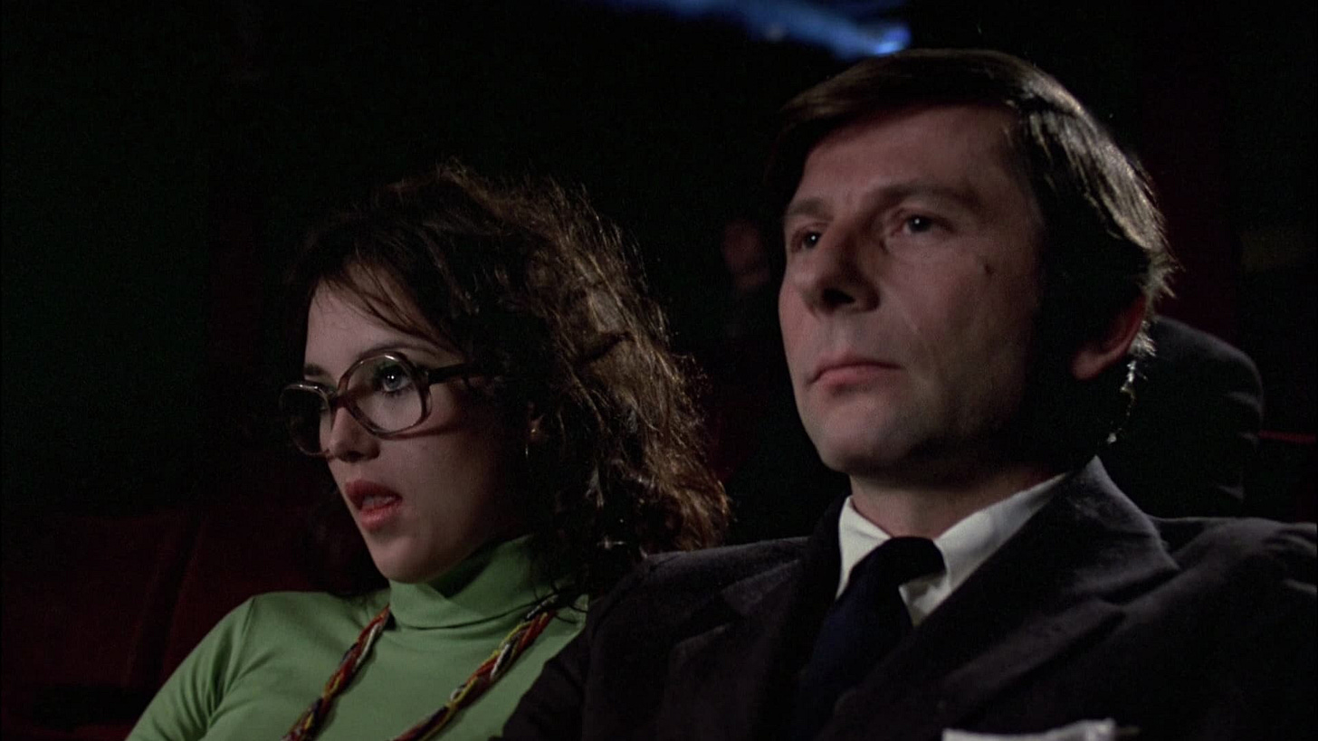 The Tenant | Still features Isabelle Adjani and Roman Polanski seated together in a theater.