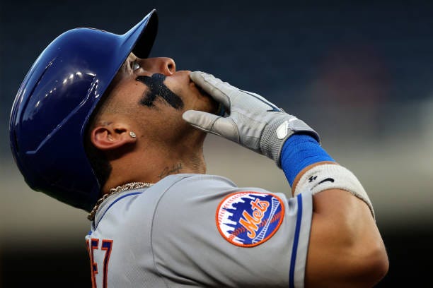 Francisco Alvarez of the New York Mets celebrates while rounding the bases after hitting a three RBI home run against the Washington Nationals in the...