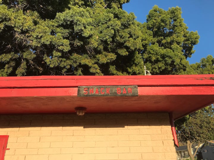 Snack Bar sign at baseball field.