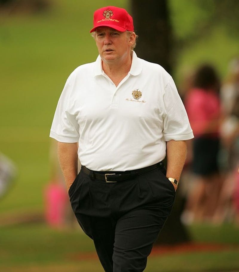 Donald Trump walks the course during a 2004 round at Trump International golf course in West Palm Beach, Florida.