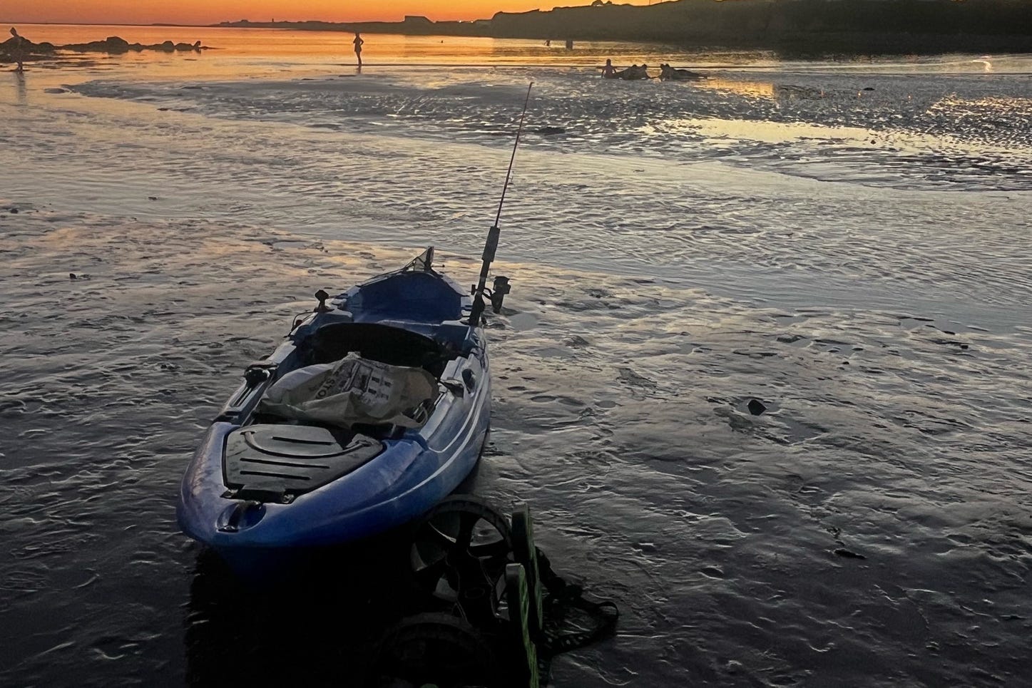 A blue fishing kayak.