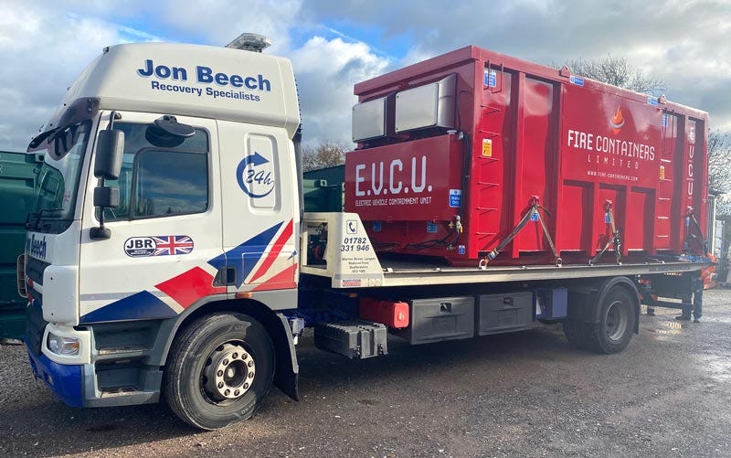 Electric Vehicle Containment unit loaded onto Jon Beech recovery truck