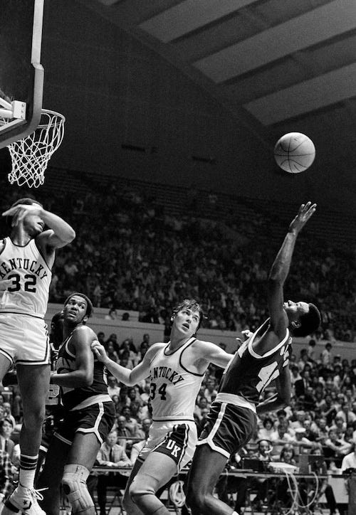 UAB forward Chris Giles reaches for a rebound during an NCAA tournament game against Kentucky