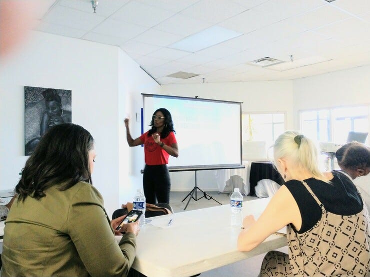 Tonier Cain gives a presentation about trauma informed care at the Creative Suitland Sept. 21. Photo by Delonte Harrod 