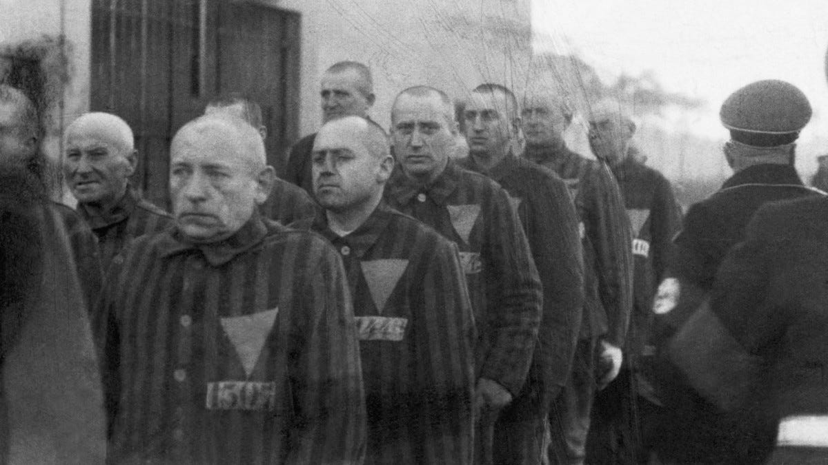 Homosexual prisoners at the concentration camp at Sachsenhausen, Germany, wearing pink triangles on their uniforms on December 19, 1938.