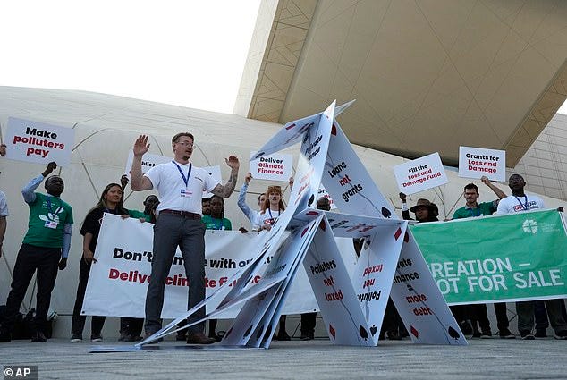 As Cop28 convened in Dubai, it was revealed that the world had used record amounts of coal, oil and natural gas in 2023. U.S. energy officials now predict that CO2 emissions will continue to rise for the next 30 years. Pictured: Activists participate in a demonstration at the COP28 U.N. Climate Summit