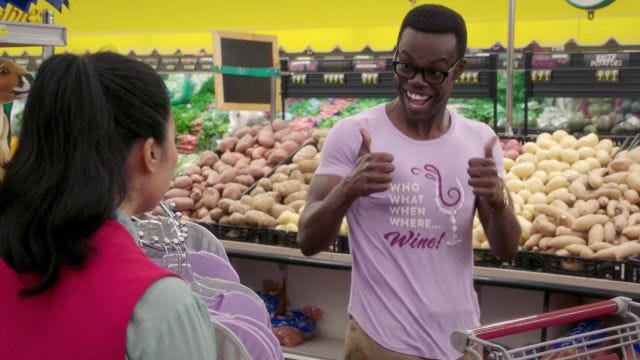 The pink t-shirt 'who what when where wine' of Chidi Anagonye (William  Jackson Harper) is in The Good Place S03E04 | Spotern