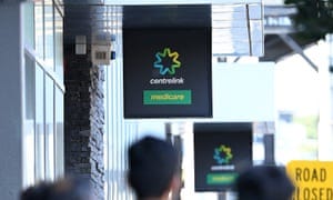 People queue to enter Centrelink on March 24, 2020 in Melbourne, Australia. 