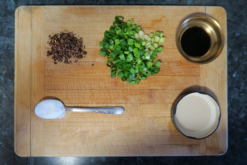 Ingredients for the dumoling mix. L-R: Sichaun pepper, spring onions, soy sauce, Chinese cooking wine, caster sugar.