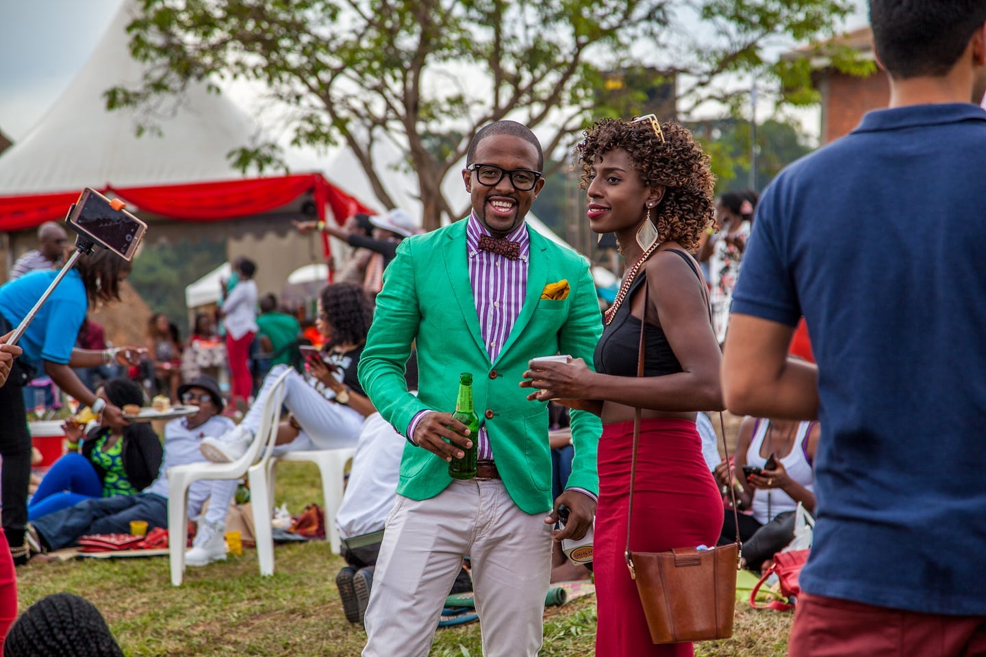 Upscale, mostly Black crowd enjoying a party