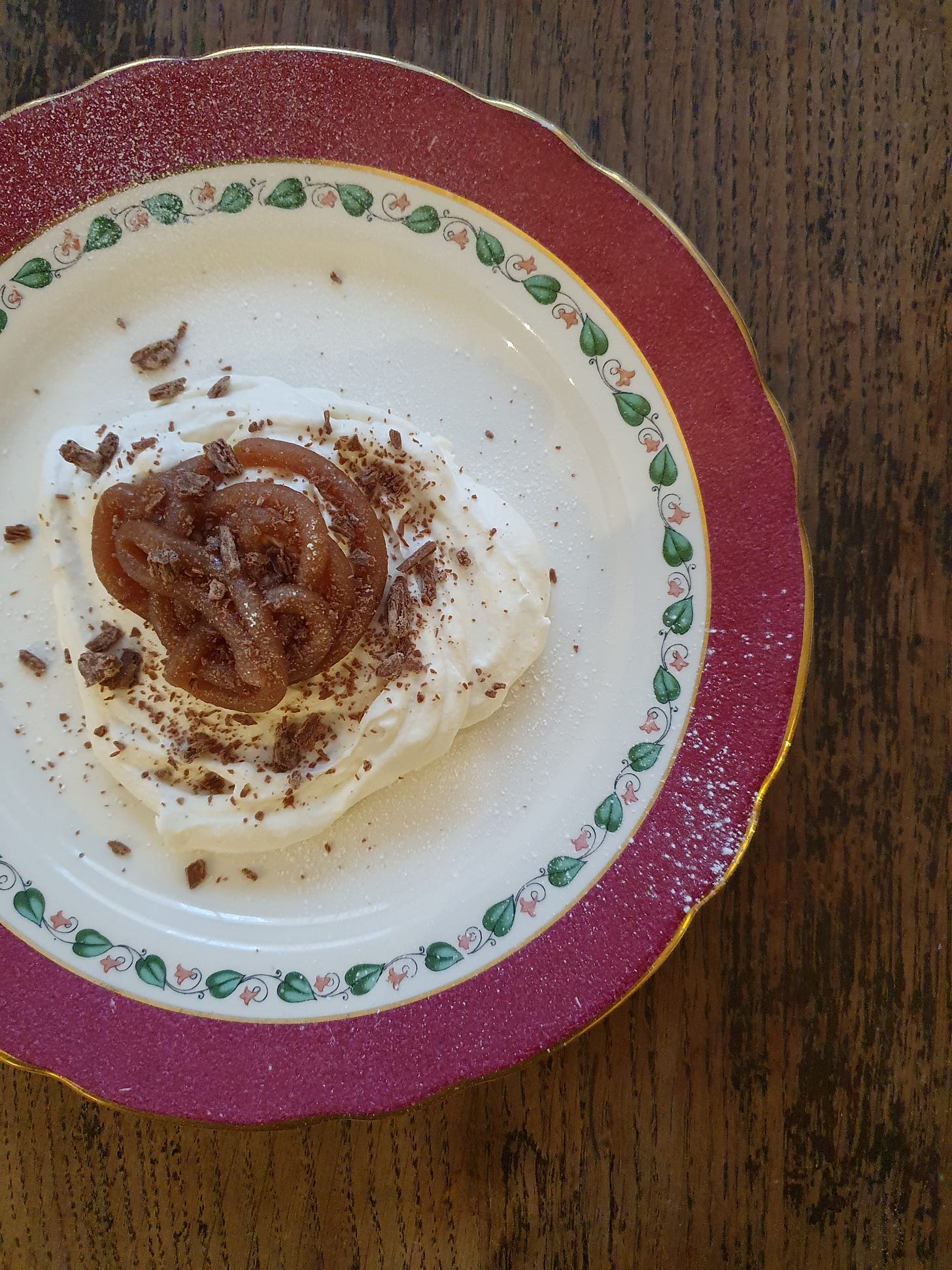 whipped cream topped with piped chestnut cream, a dusting of icing sugar and flakes of chocolate