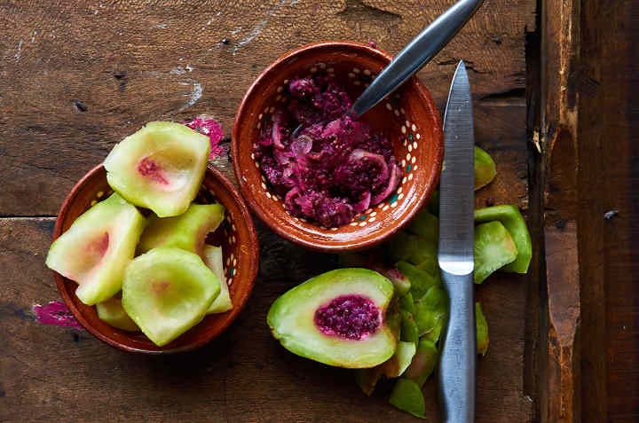 cut up cactus fruit on table