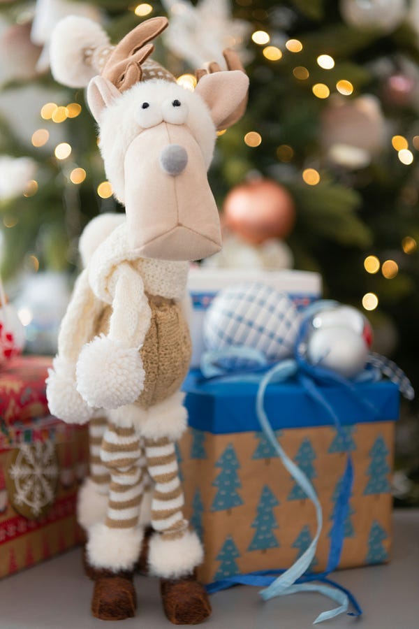 A toy lion with a gift. A toy lion with a gift.