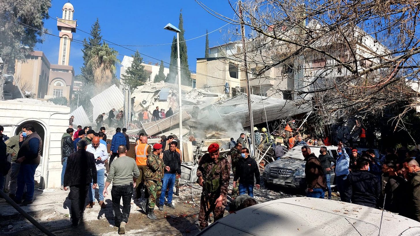 TOPSHOT - People and security forces gather in front of a building destroyed in a reported Israeli strike in Damascus on January 20, 2024. An Israeli strike on Damascus killed five people in a building where "Iran-aligned leaders" were meeting on January 20, a war monitor said, as regional tensions soar over the Israel-Hamas war. (Photo by Louai Beshara / AFP) (Photo by LOUAI BESHARA/AFP via Getty Images) TOPSHOT - People and security forces gather in front of a building destroyed in a reported Israeli strike in Damascus on January 20, 2024. An Israeli strike on Damascus killed five people in a building where "Iran-aligned leaders" were meeting on January 20, a war monitor said, as regional tensions soar over the Israel-Hamas war. (Photo by Louai Beshara / AFP) (Photo by LOUAI BESHARA/AFP via Getty Images)
