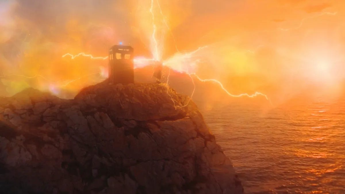 This image shows, in long shot, the Thirteenth Doctor (played by Jodie Whittaker) regenerating at the conclusion of "The Power of the Doctor." The TARDIS rests atop Durdle Door (on the Dorset coast of England) while amber regeneration energy streams from the Doctor's body to join the morning sunlight in a colorful tableau. This image shows, in long shot, the Thirteenth Doctor (played by Jodie Whittaker) regenerating at the conclusion of "The Power of the Doctor." The TARDIS rests atop Durdle Door (on the Dorset coast of England) while amber regeneration energy streams from the Doctor's body to join the morning sunlight in a colorful tableau.