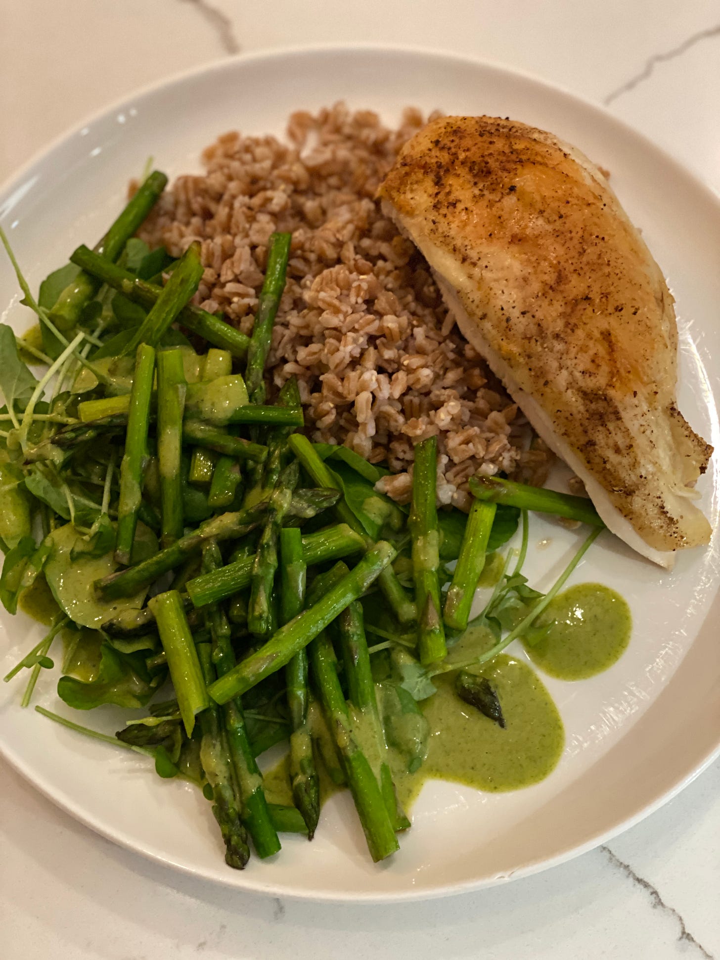 roast chicken breast with five spice over farro, watercress, and asparagus, with tarragon dressing