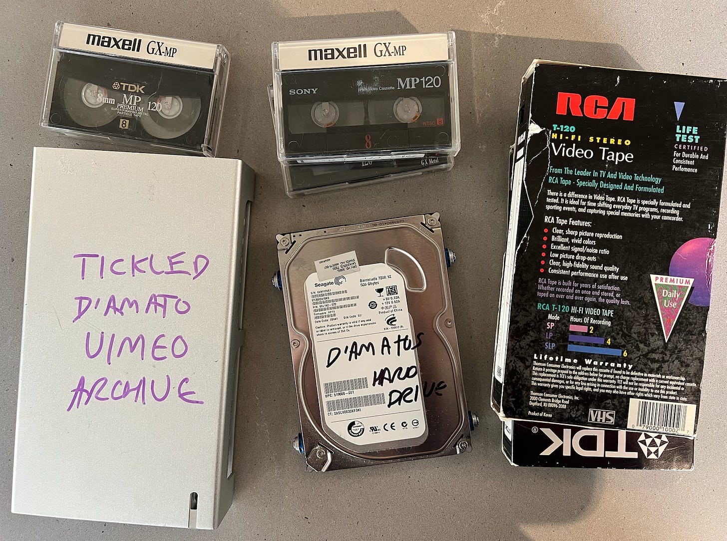 A bunch of VHS tapes, hard drives and other data carrying devices!