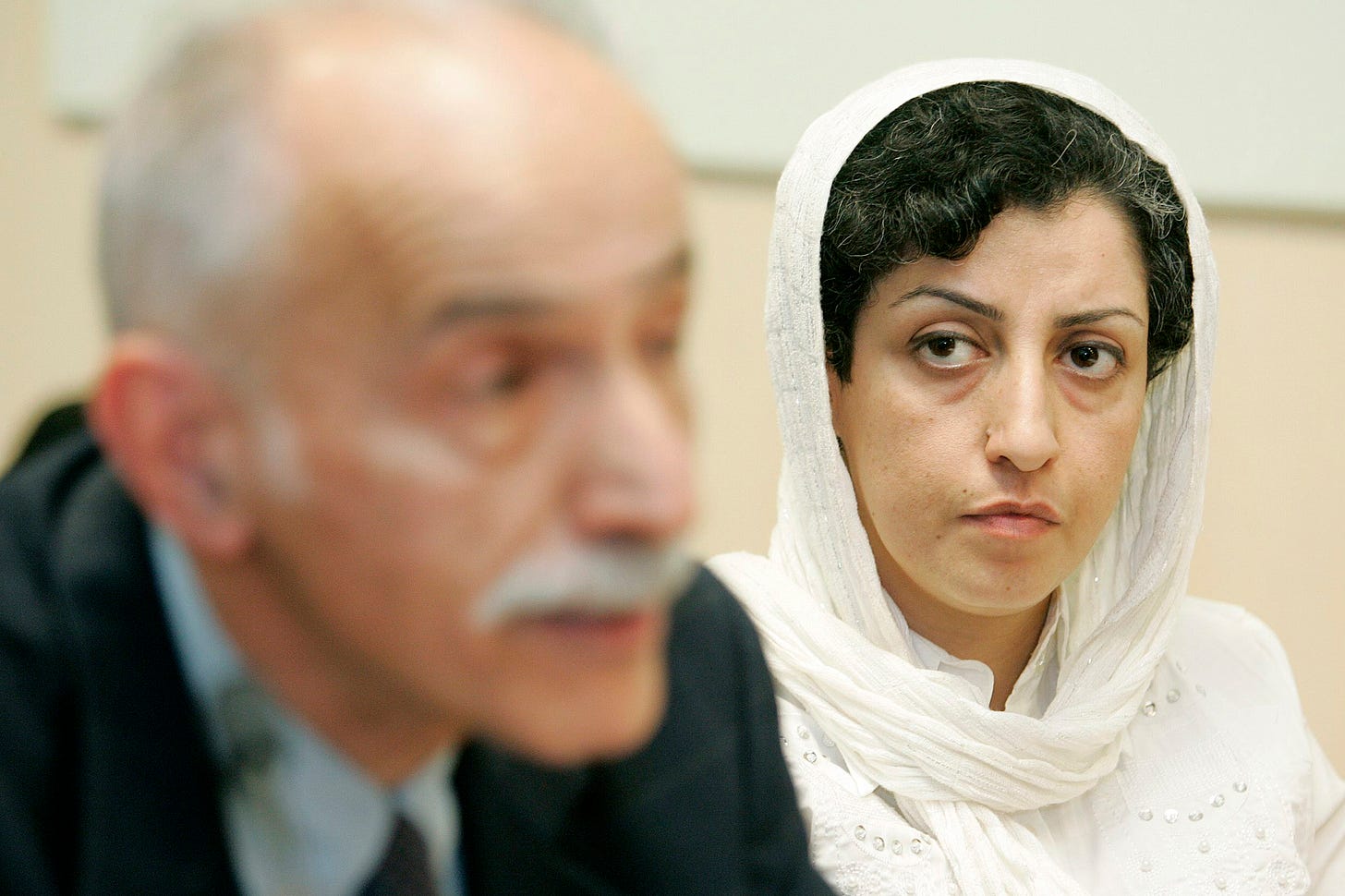 Iranian activist Narges Mohammadi, right, from the center for Human Rights Defenders, listens to Karim Lahidji, president of the Iranian league for the Defence of Human Rights, during a press conference on the Assessment of the Human Rights Situation in Iran, at the UN headquarters in Geneva, Switzerland, on June 9, 2008. The Nobel Peace Prize has been awarded to Narges Mohammadi for fighting oppression of women in Iran.  (Magali Girardin—Keystone via AP)